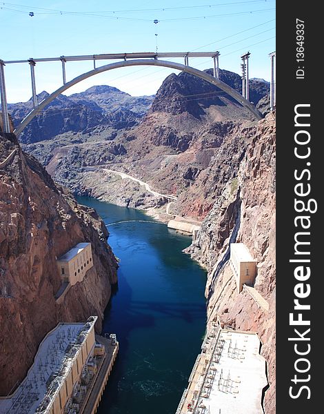 Hoover Dam and the Colorado river with under construction bridge.