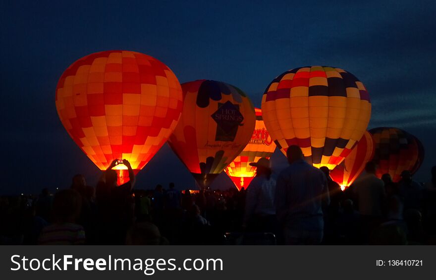 Hot air balloons lighting up the fire and
