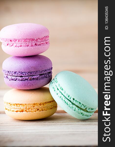 Macaroons and the table. Dessert background. Studio shoot