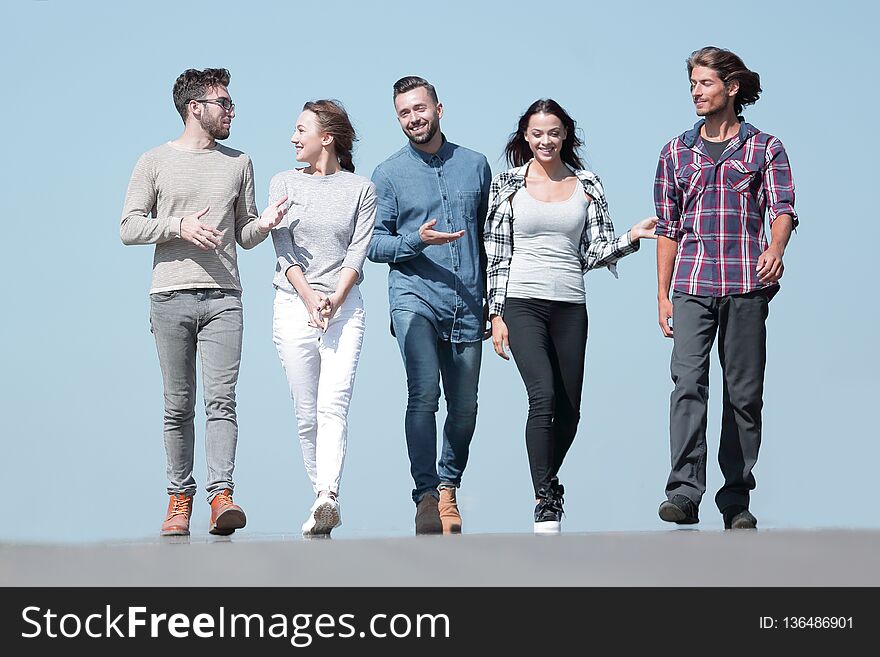 Team of friends, walks on the road .outdoors.photo with copy space .