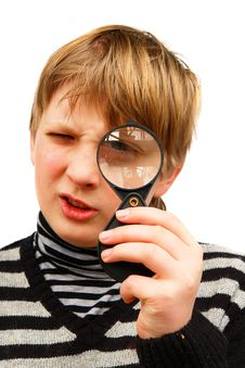 A Boy And A Magnifying Glass Stock Image