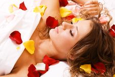 Beautiful Young Woman Lying In Rose Petals Royalty Free Stock Photography Beautiful Young Woman Lying In Rose Petals Royalty Free Stock Photography