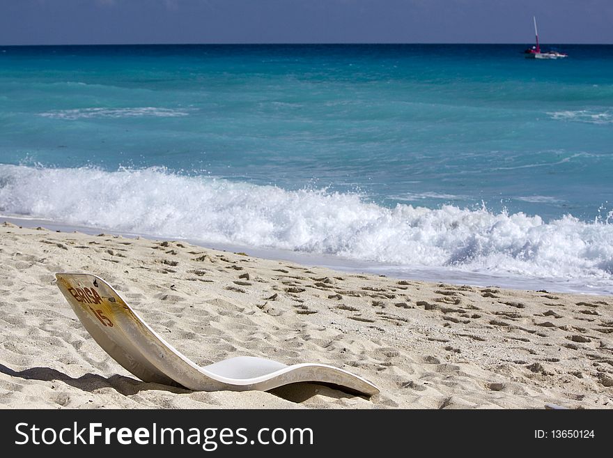 Beachfront living, beach chair in the sand. Beachfront living, beach chair in the sand.