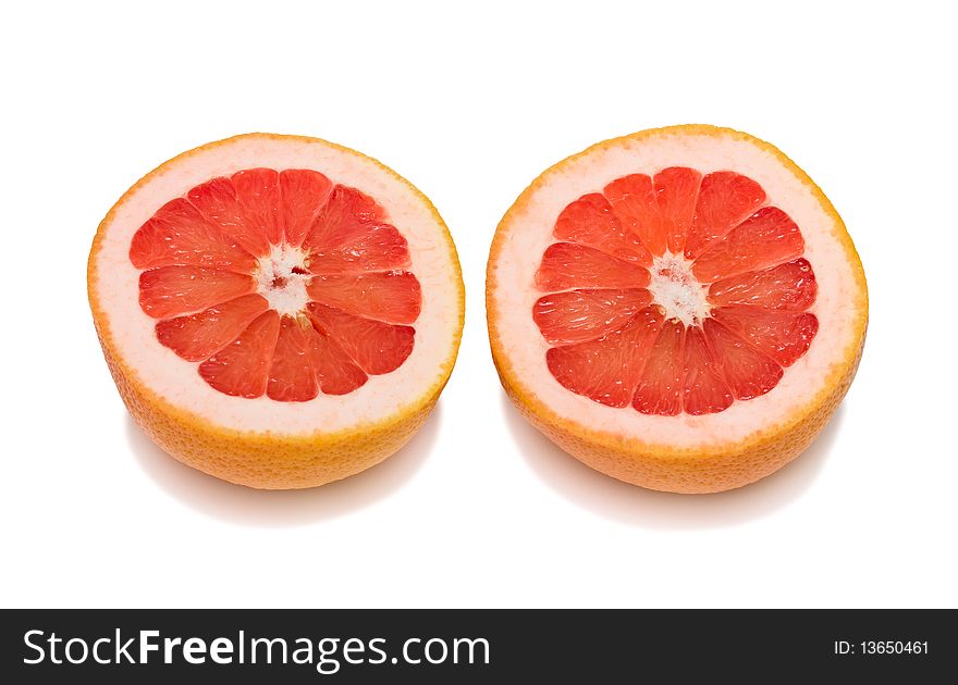 Two sections of ripe grapefruit. Isolated. Two sections of ripe grapefruit. Isolated.