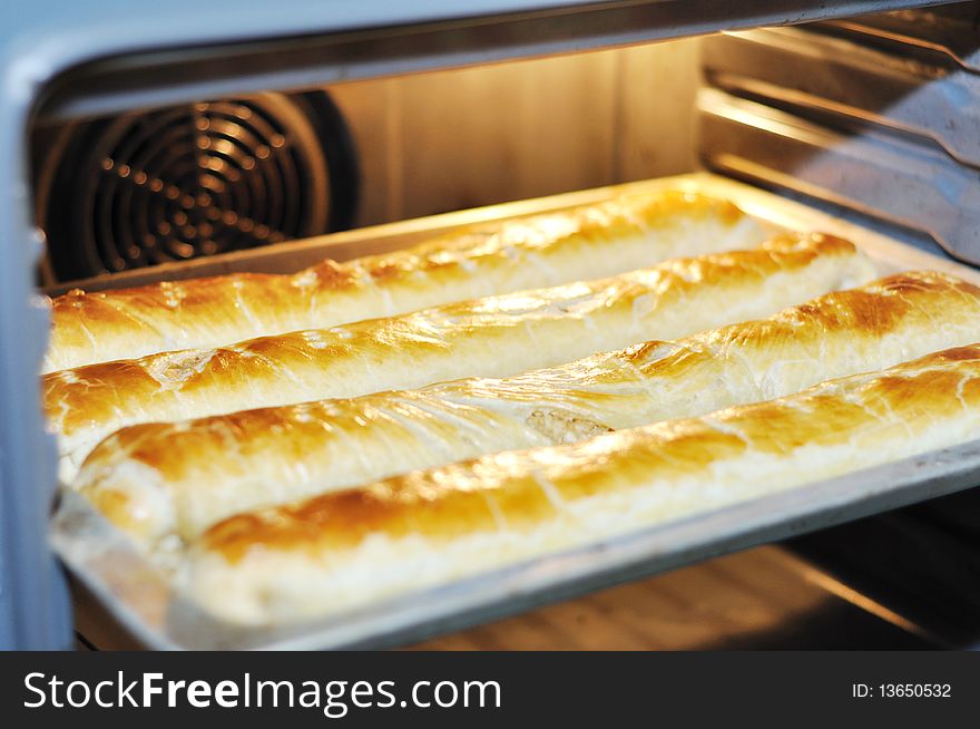 Baking apple pie in shape of socks in an electric oven