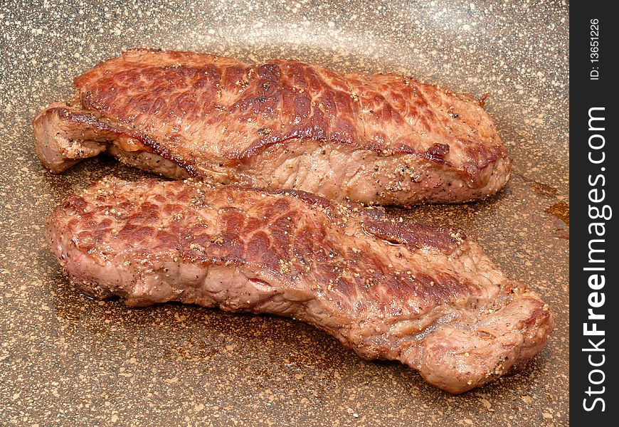 Freshly fried beef steaks, brown and good