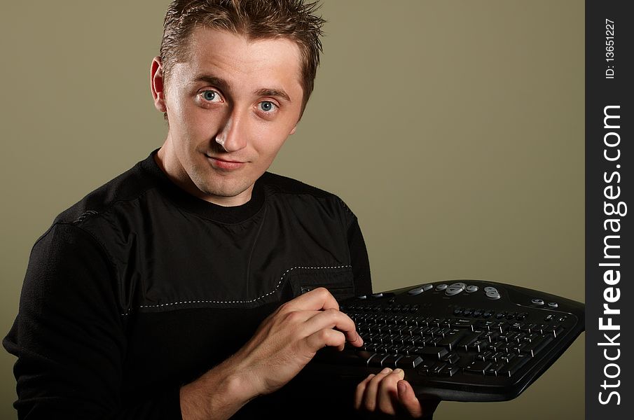 Happy young man with keyboard