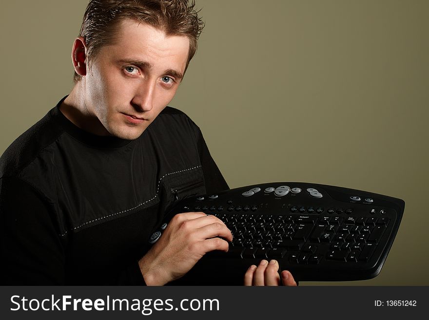Happy young man with keyboard