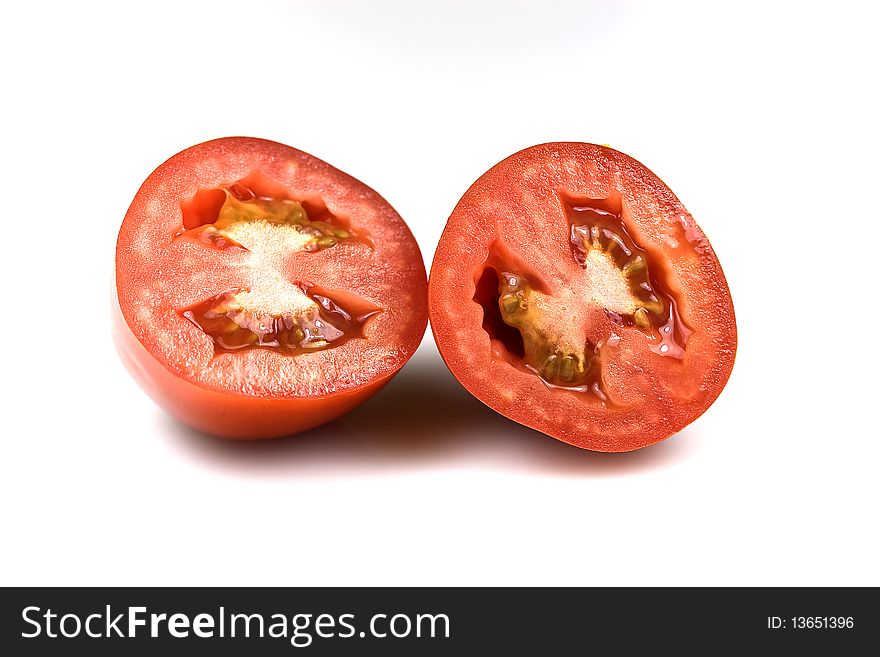 Roma tomato â€“ transversal section on white. Roma tomato â€“ transversal section on white