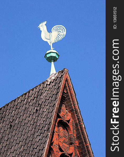 Weathercock made of copper on an tower. Weathercock made of copper on an tower