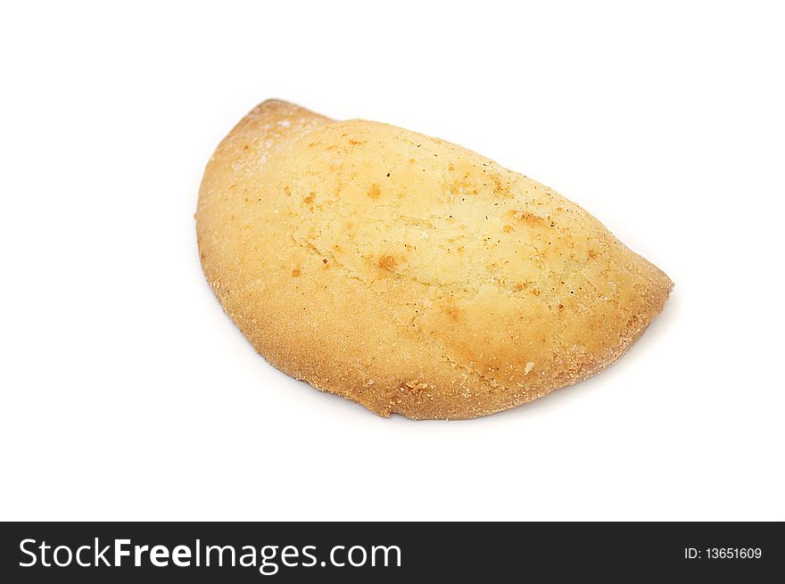 A freshly baked bun with curd filling isolated on a white background