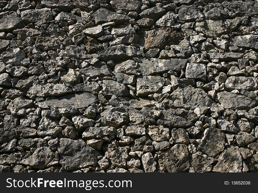 Old fortress wall made of solid stones. Old fortress wall made of solid stones