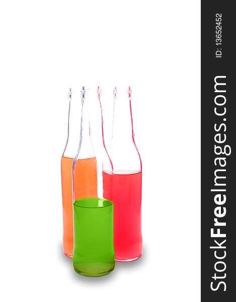 Three bottles with colorful alcohol drinks isolated on white. Three bottles with colorful alcohol drinks isolated on white