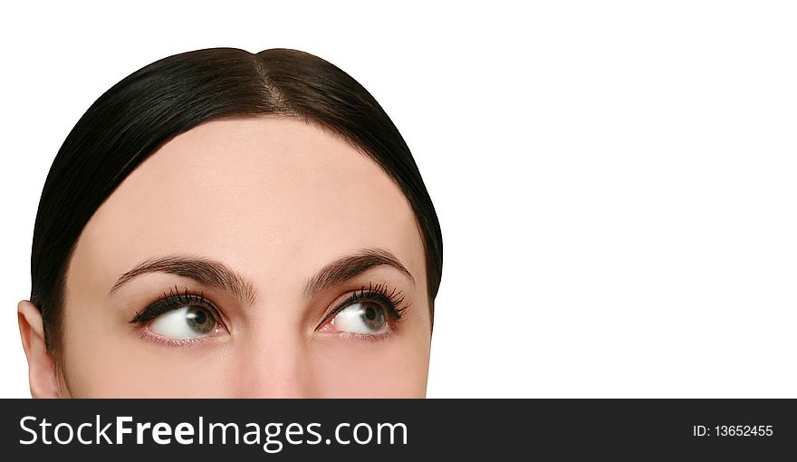 Young woman looks up and thinks on white background
