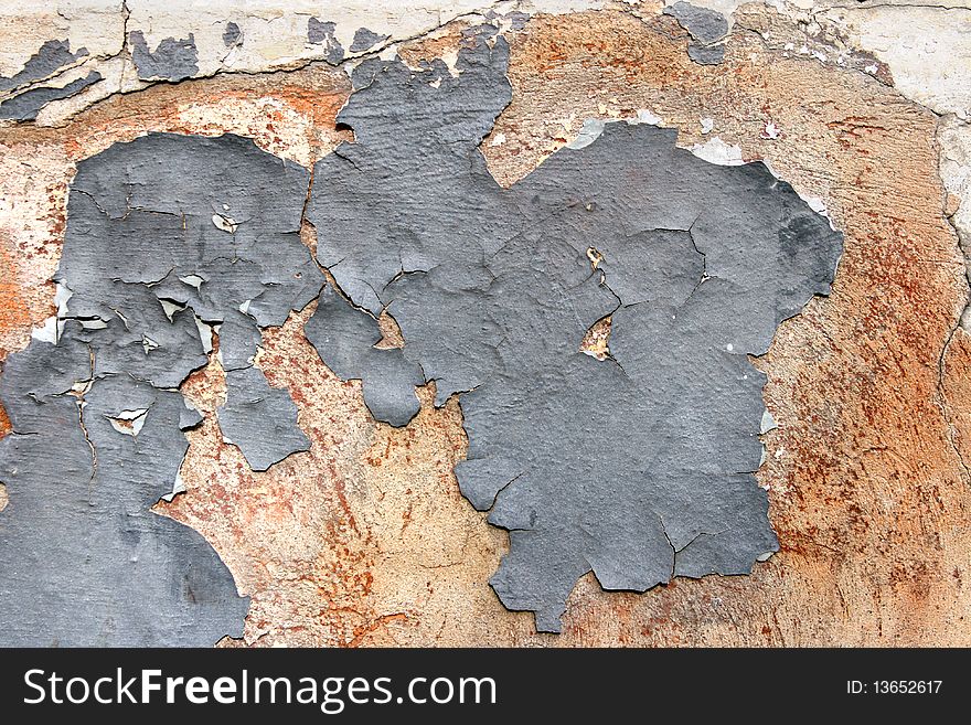 Grunge scratched texture / background on a cracked stone wall. Grunge scratched texture / background on a cracked stone wall.