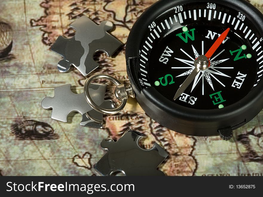 Compass on the old map. Concept travel.