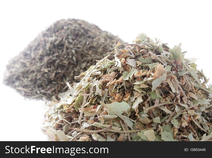 Two Piles Of Herbs On White Background