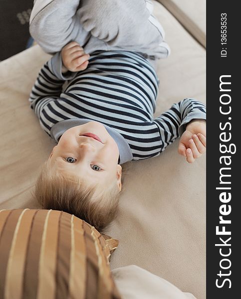 Boy laying on his back and smiling. Boy laying on his back and smiling