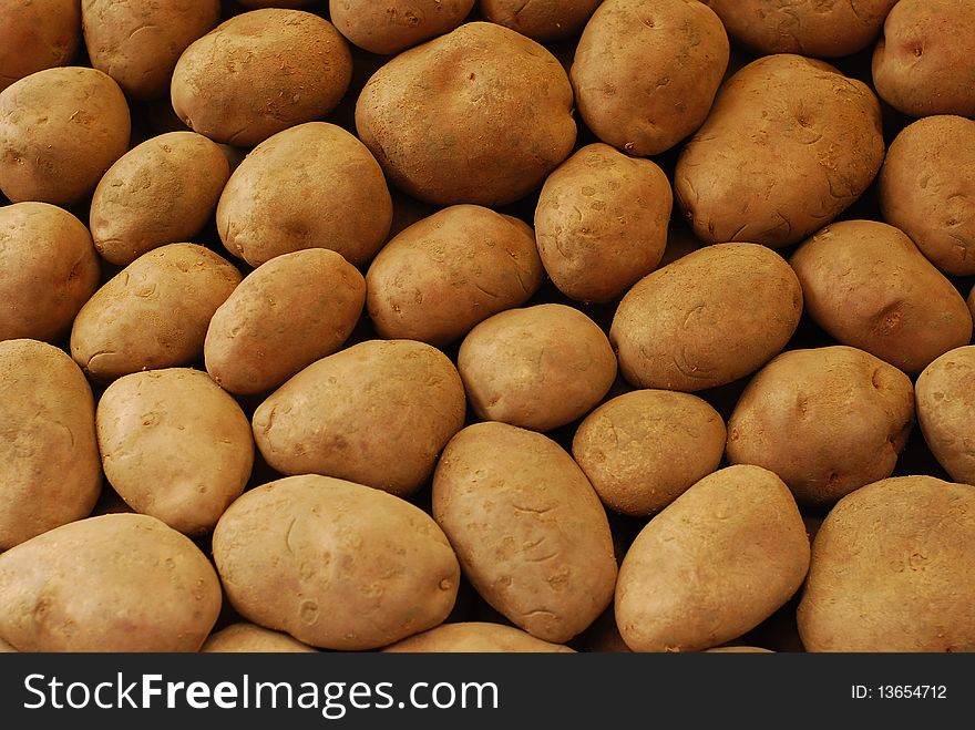 Many raw potatoes at the market