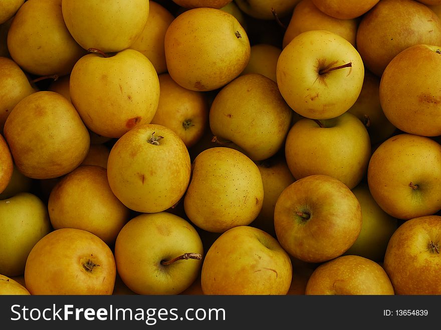 Fresh yellow apples at the market