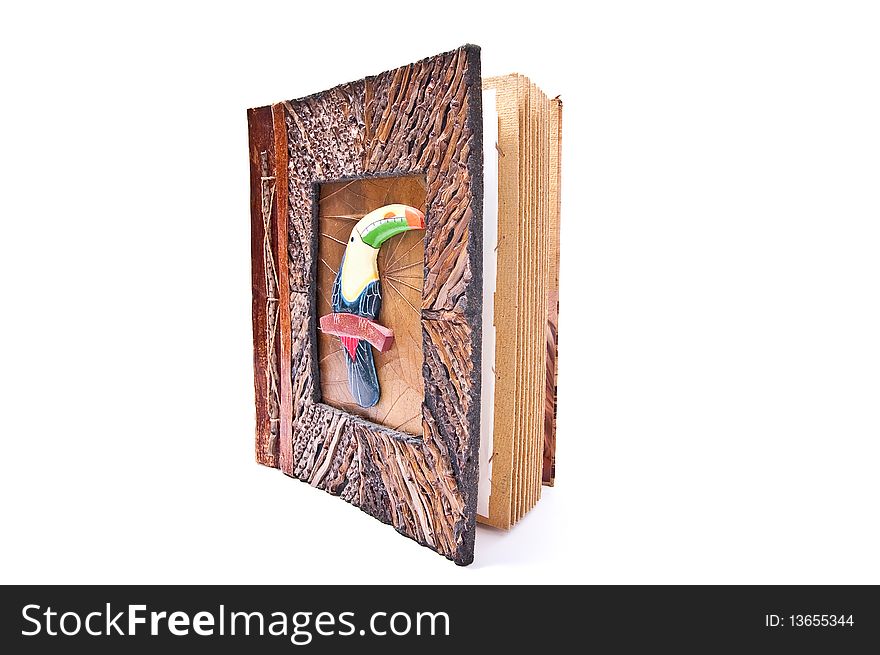 Wooden photo album with parrot isolated on white