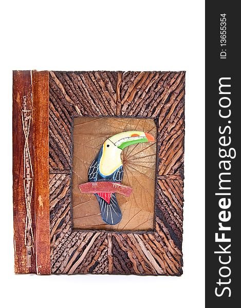 Wooden photo album with parrot isolated on white background