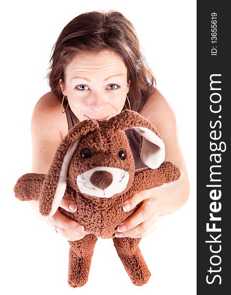 Young beautiful woman holding up a bunny towards the camera. Young beautiful woman holding up a bunny towards the camera.