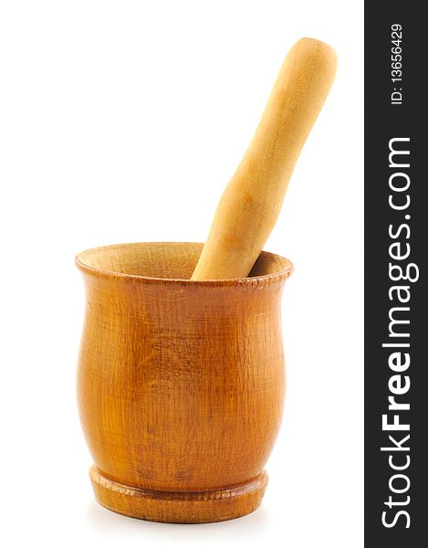 Wooden mortar and pestle photographed in front of white background