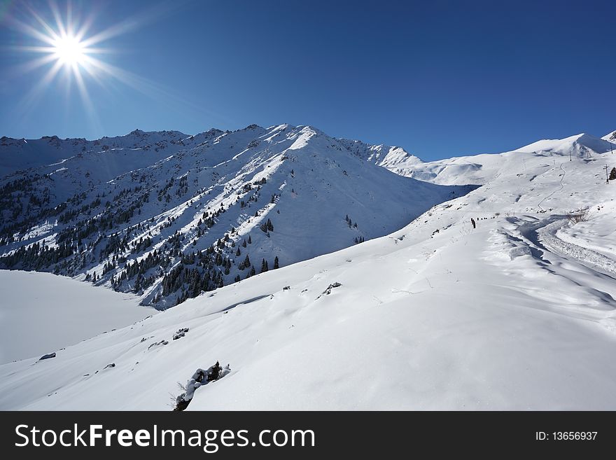 The winter sun over mountains