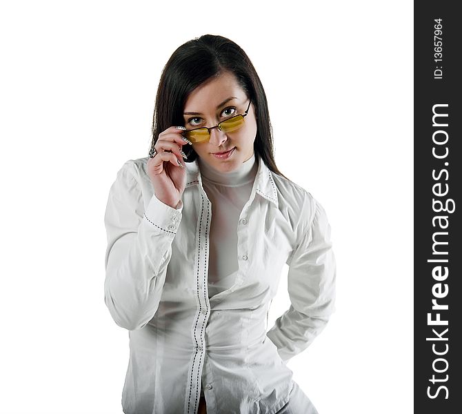 Close-up Portrait of a beautiful young woman in a white shirt and glasses. Close-up Portrait of a beautiful young woman in a white shirt and glasses