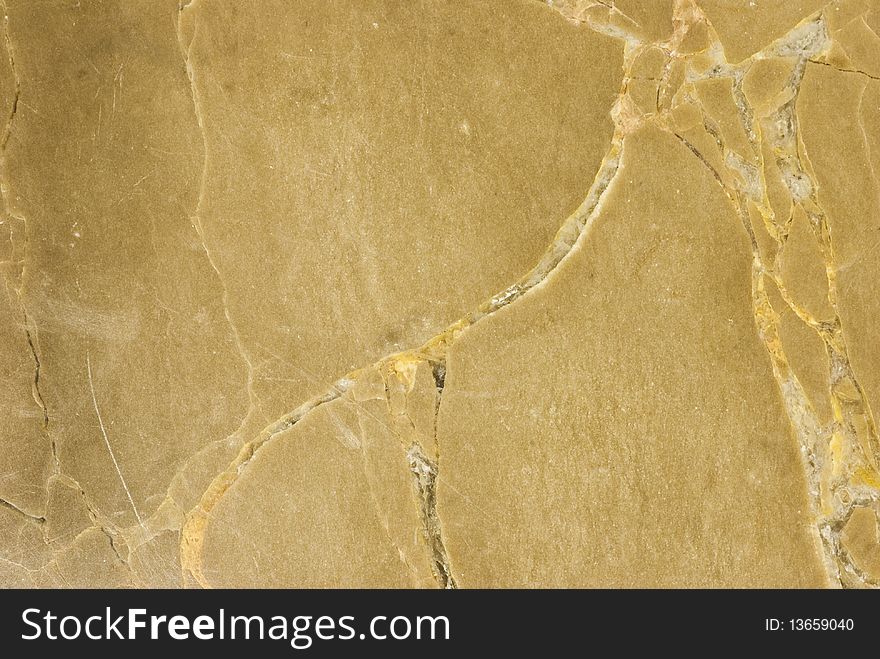 Closeup of beige stone with natural patterns