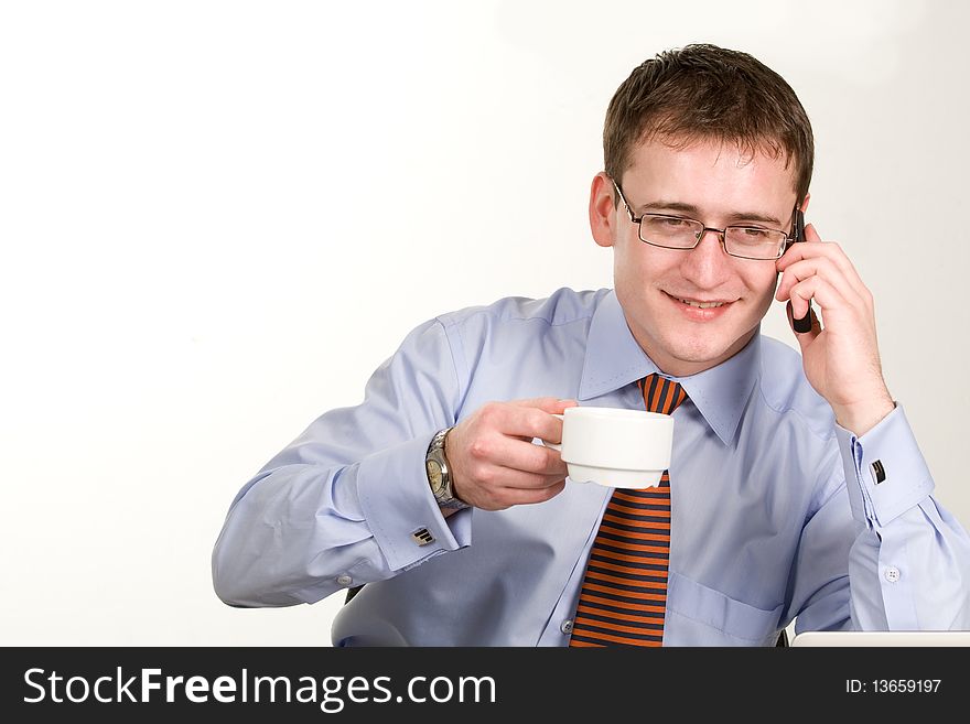 Handsome young businessman with coffee cup