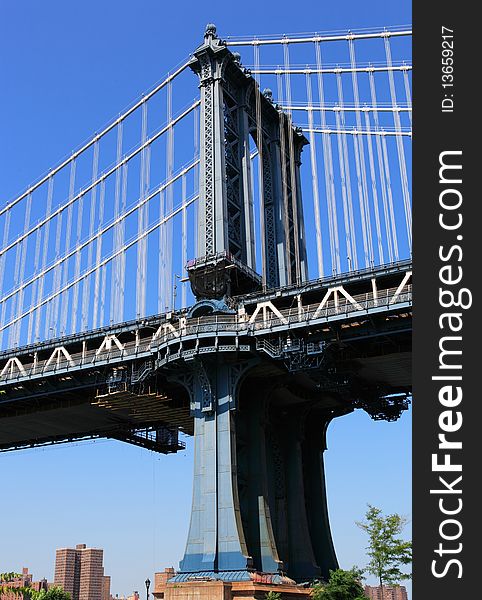 New York City bridge pillar with deep blue sky