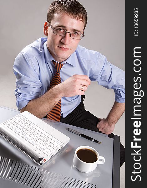 Handsome young businessman with coffee cup