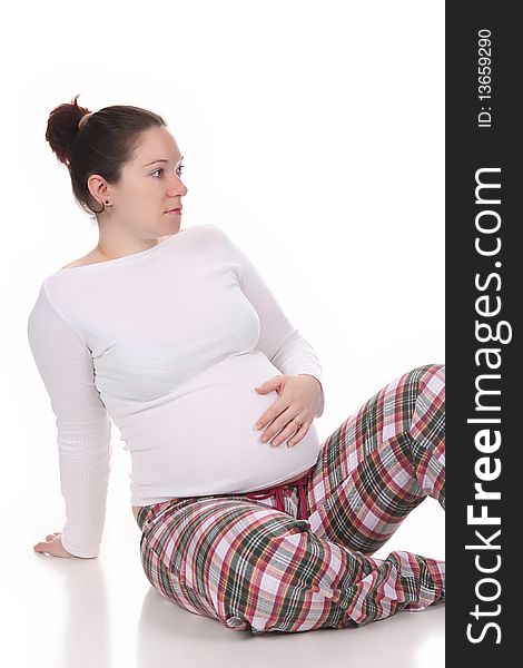 Pregnant woman holding belly on white background