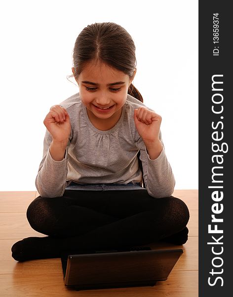 Young child looking happy using laptop. Young child looking happy using laptop