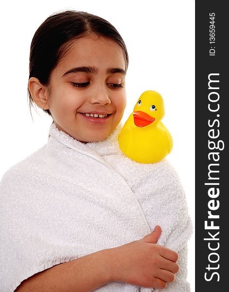 Cute young child looking at rubber duck isolated on white. Cute young child looking at rubber duck isolated on white