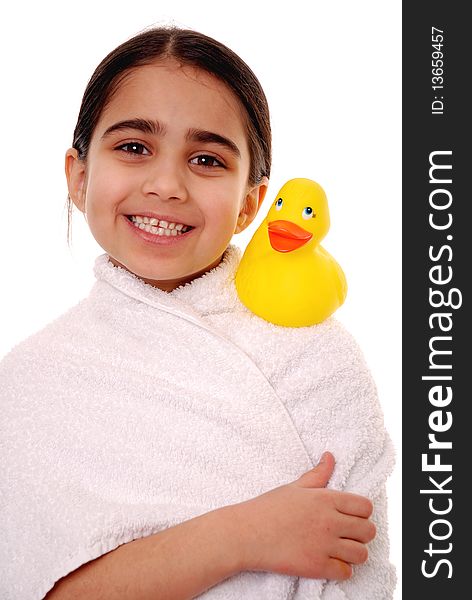 Smiling girl with rubber duck isolated on white. Smiling girl with rubber duck isolated on white