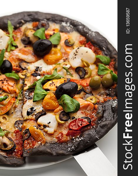 Black Ink Dough Pizza with Seafood, Black and Green Olives, Dried Tomato and Salad Leaves. Black Ink Dough Pizza with Seafood, Black and Green Olives, Dried Tomato and Salad Leaves