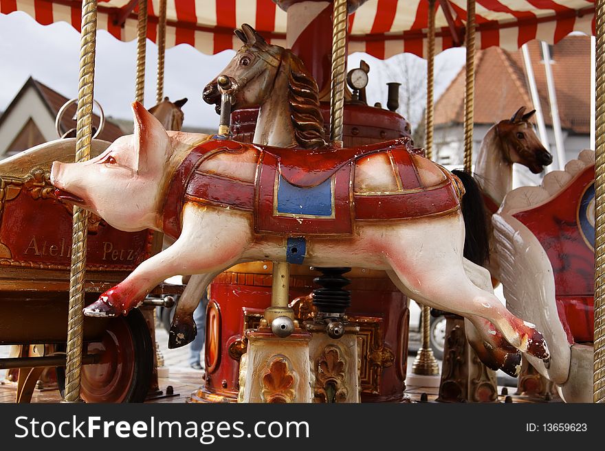 Beautiful old carousel with pork