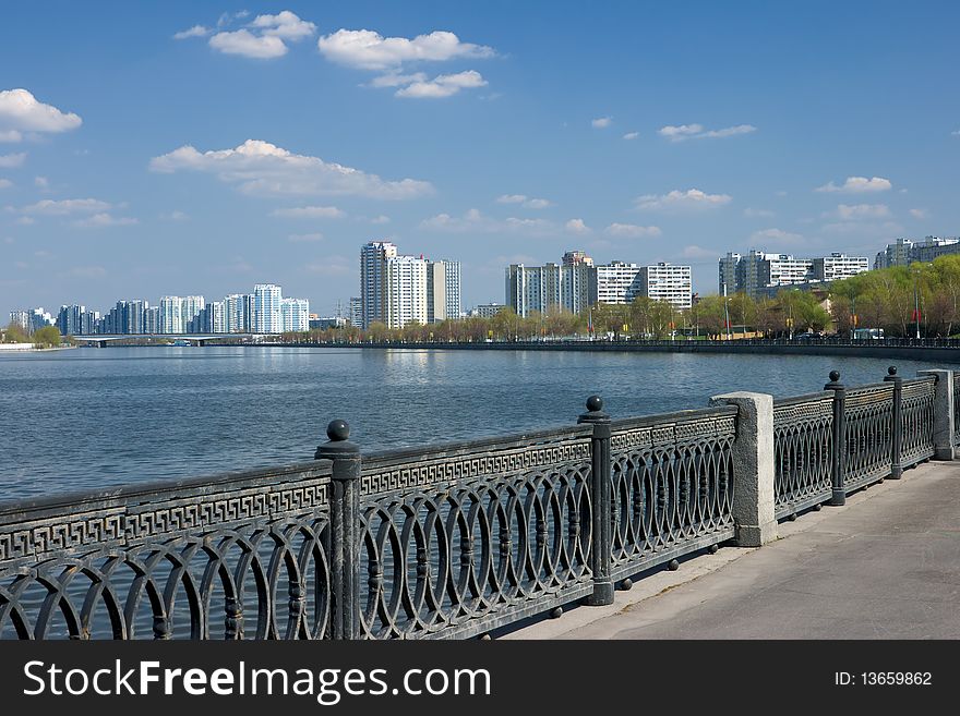 Quay of moscow river with homes on horizon. Quay of moscow river with homes on horizon