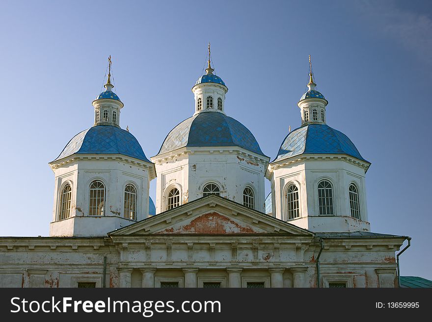 Three cupola of old church over blue sky. Three cupola of old church over blue sky
