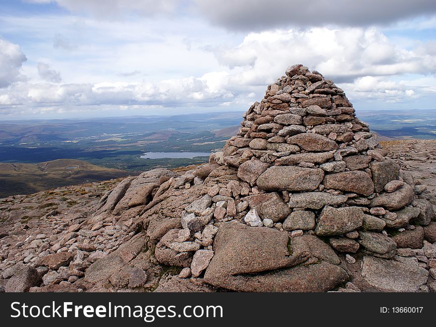 A mound of rocks upon a mountain top. A mound of rocks upon a mountain top.
