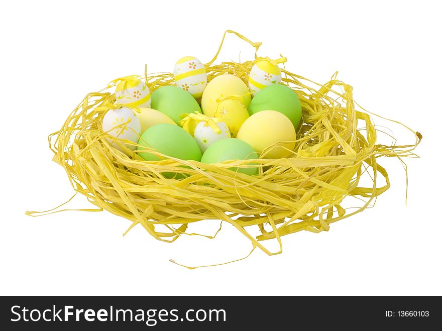 Nest with colorful painted Easter eggs isolated on white background with clipping path