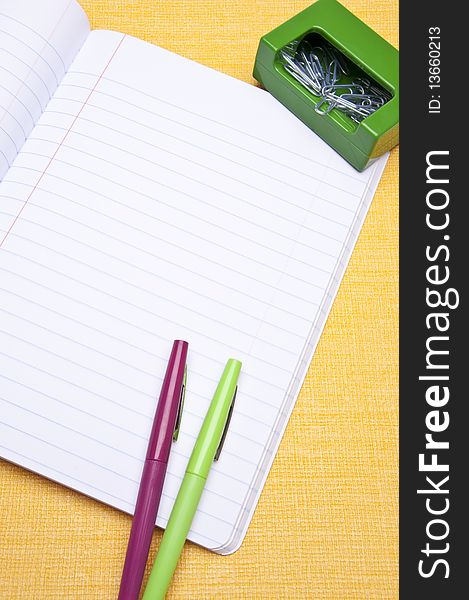 Open notebook with colorful pen for the modern student or office. Open notebook with colorful pen for the modern student or office.