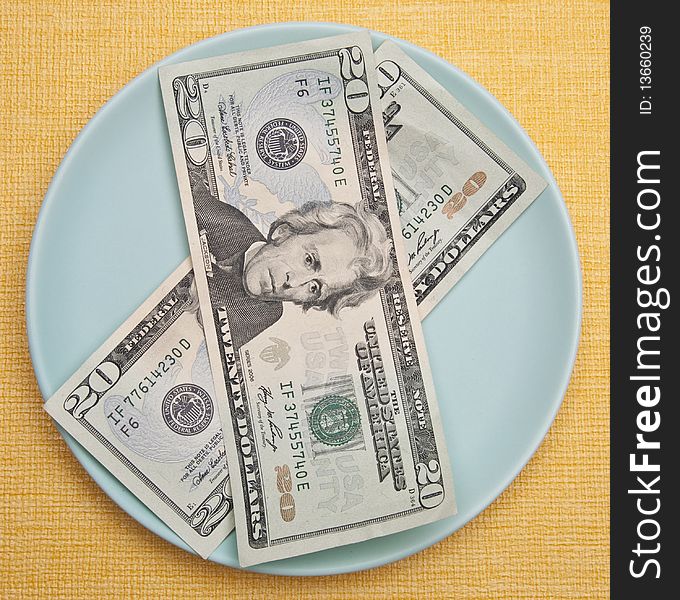 Money on a Plate represents the cost of food.