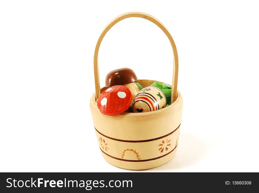 Decorative wood products in the form of baskets of mushrooms, isolated on a white background. Decorative wood products in the form of baskets of mushrooms, isolated on a white background