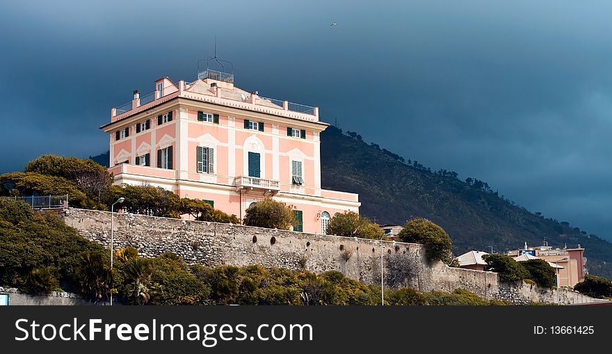 A typical elegant villa on the Ligurian Riviera and the approach of a storm. A typical elegant villa on the Ligurian Riviera and the approach of a storm