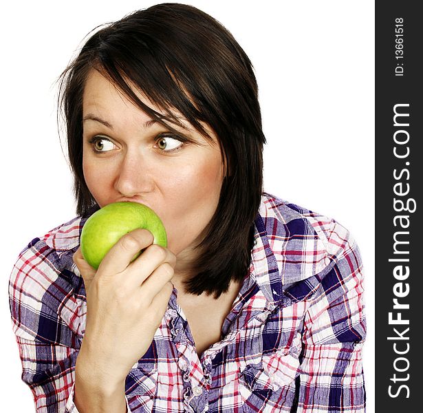 Portrait of a cheerful girl eating an apple