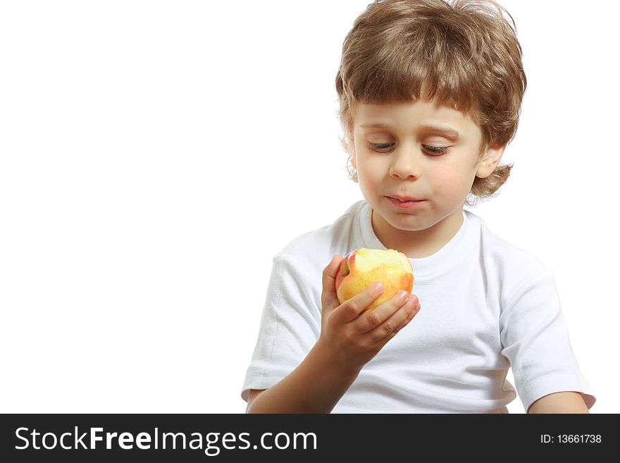 Little beautiful child playing and eating an apple - isolated on white. Little beautiful child playing and eating an apple - isolated on white